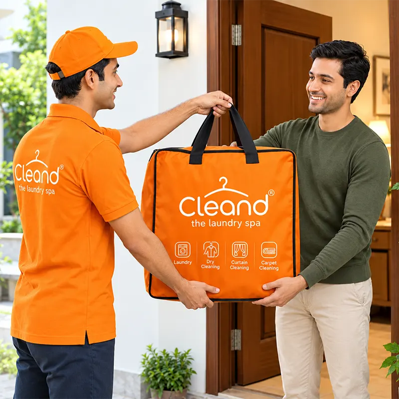 Professionally packed garment order handed to a customer at their doorstep